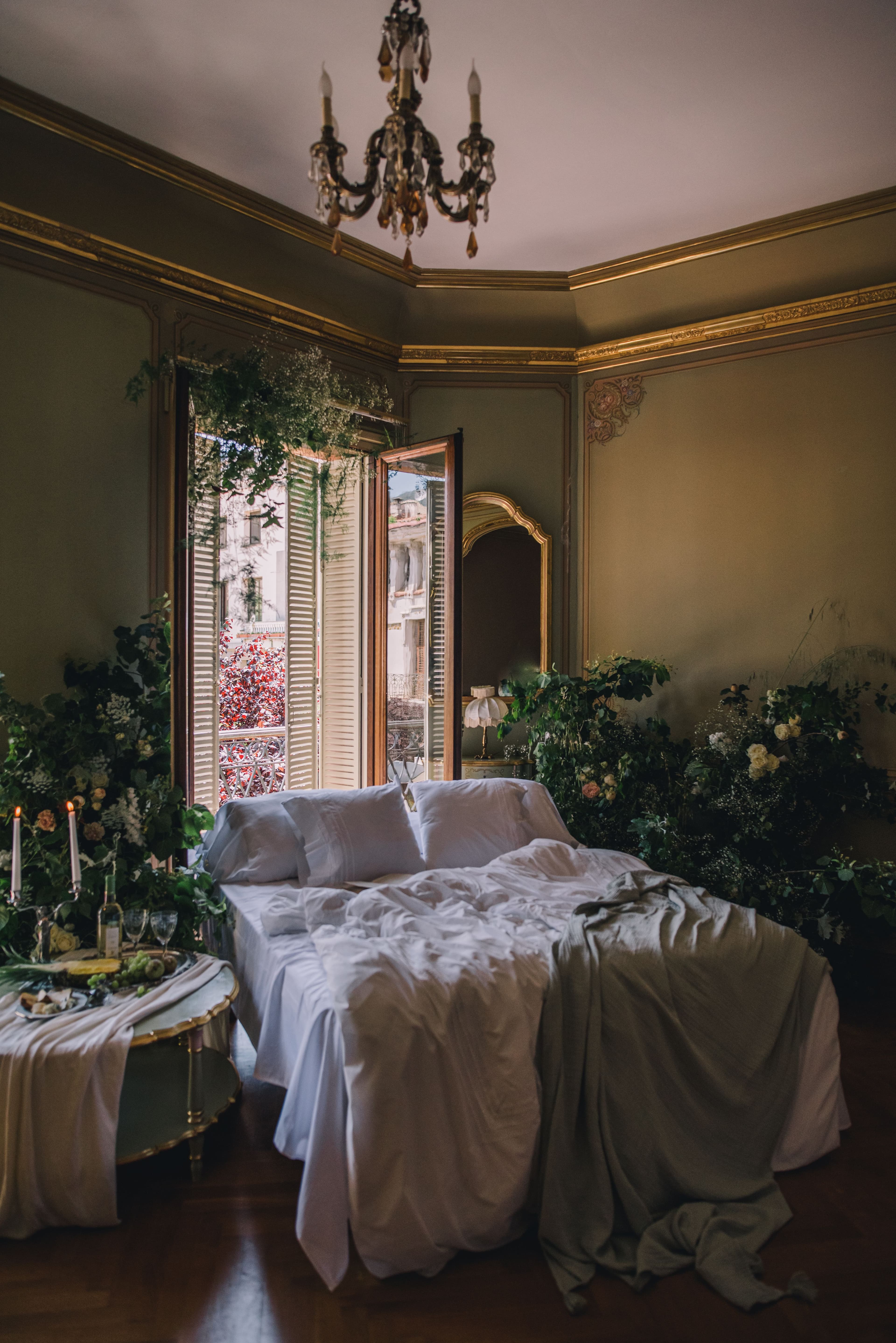 A romantic room dressed in greenery, waiting to be lived in